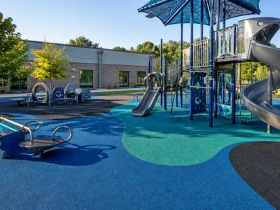 Playground in blue and green rubber safety surfacing
